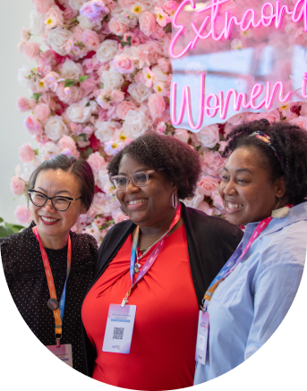 Image of three women taking a picture on Extraordinary Women in Tech global conference 2023